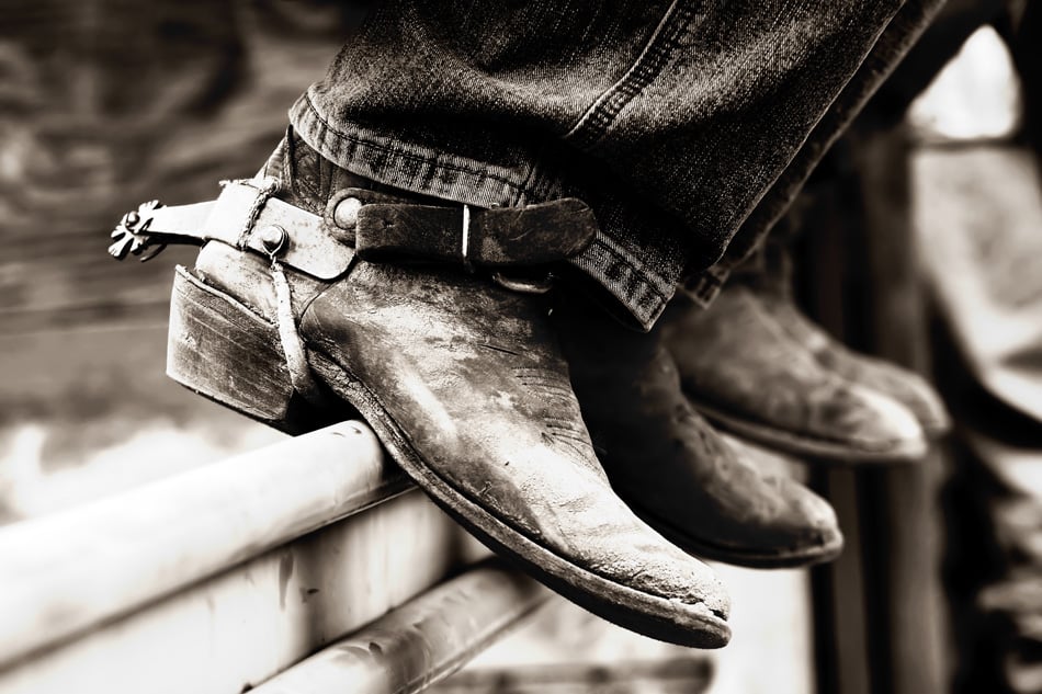 Row Of Rodeo Boots And Spurs