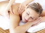 Relaxed Smiling Woman Receiving A Back Massage