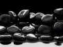 Black Stones On Calm Water Background