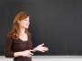 Young Teacher Lectures In Front Of The Blackboard