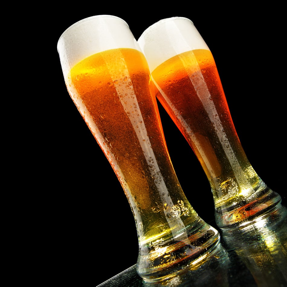 Two Glasses Of Beer With Froth