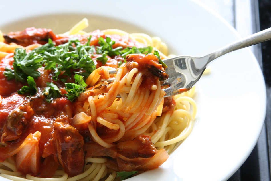 Spaghetti With Tomato Sauce And Persil Garnish