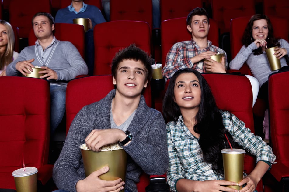 Young People Watching A Movie At The Cinema