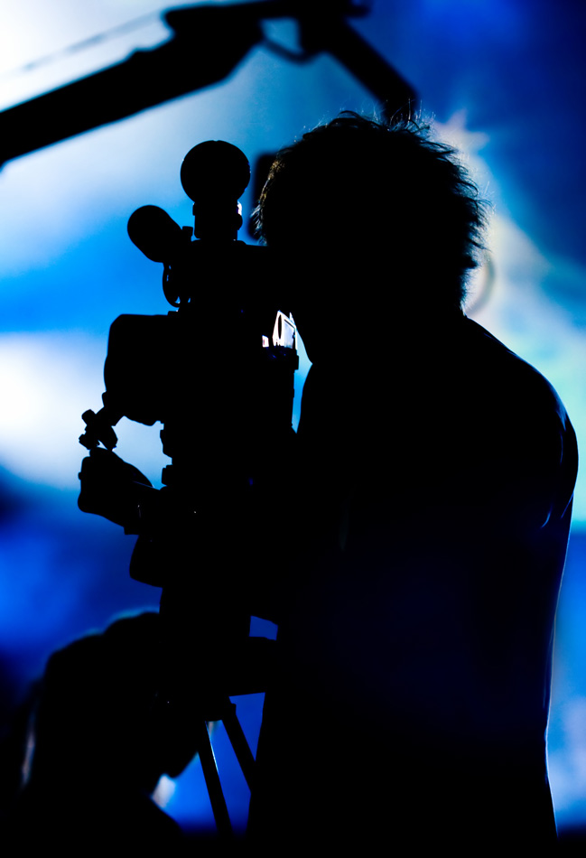 Silhouette Of A Cameraman Filming Fashion Show