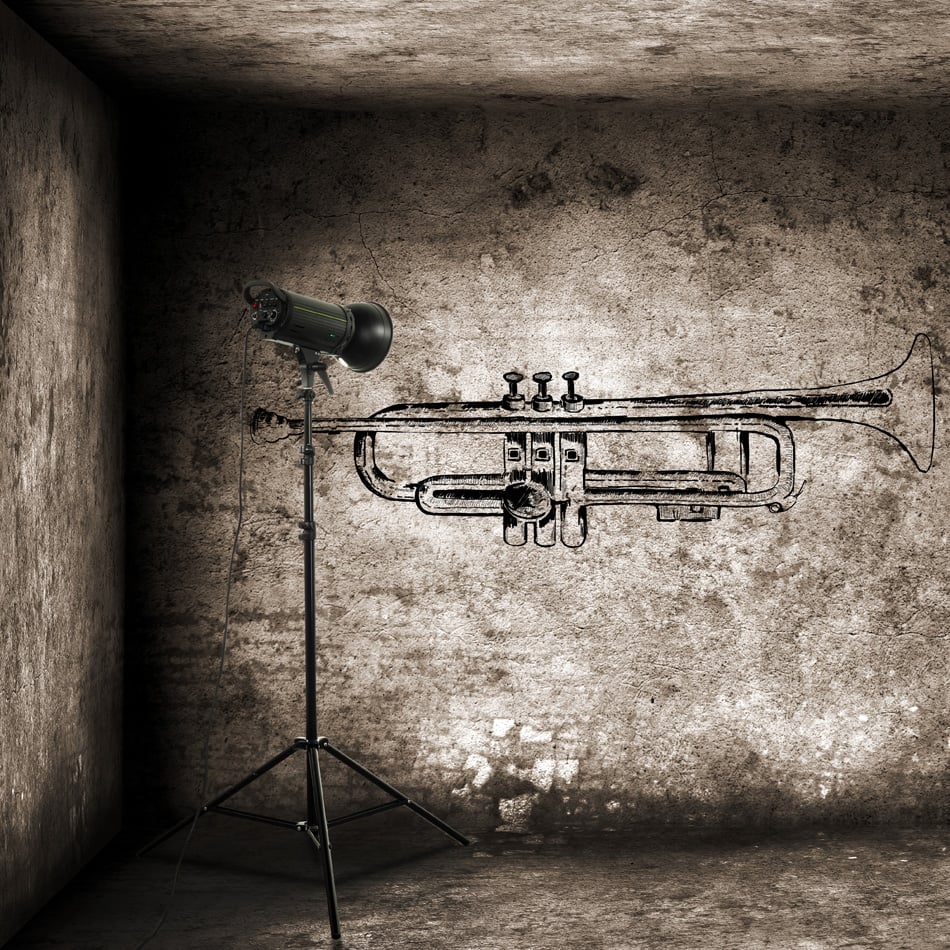 Grunge Style Graffitti of Trumpet on wall with lighting