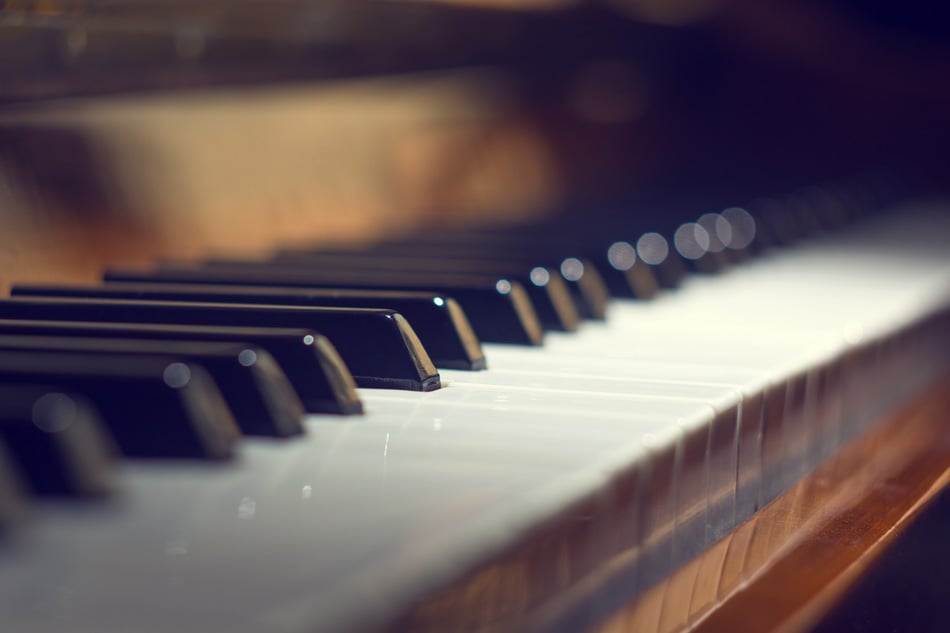 Piano keyboard background with selective focus Warm colors