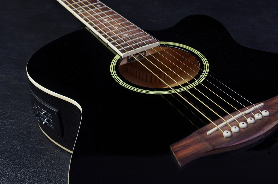 Acoustic guitar on black