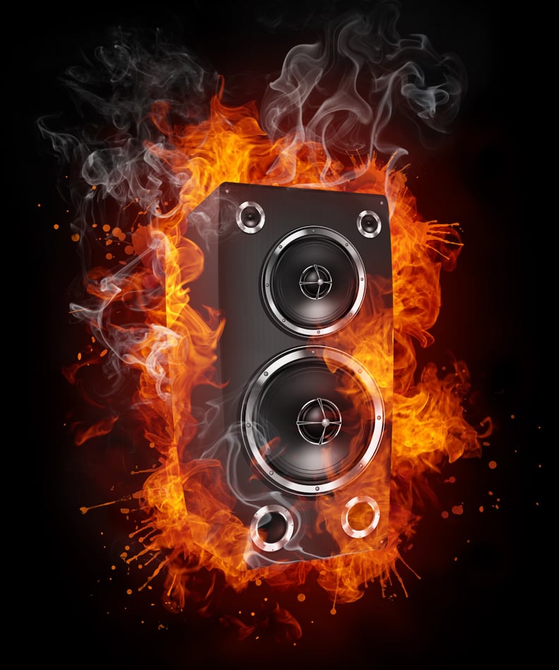 Loudspeaker In Fire Isolated On Black Background