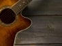 Acoustic guitar on wood background