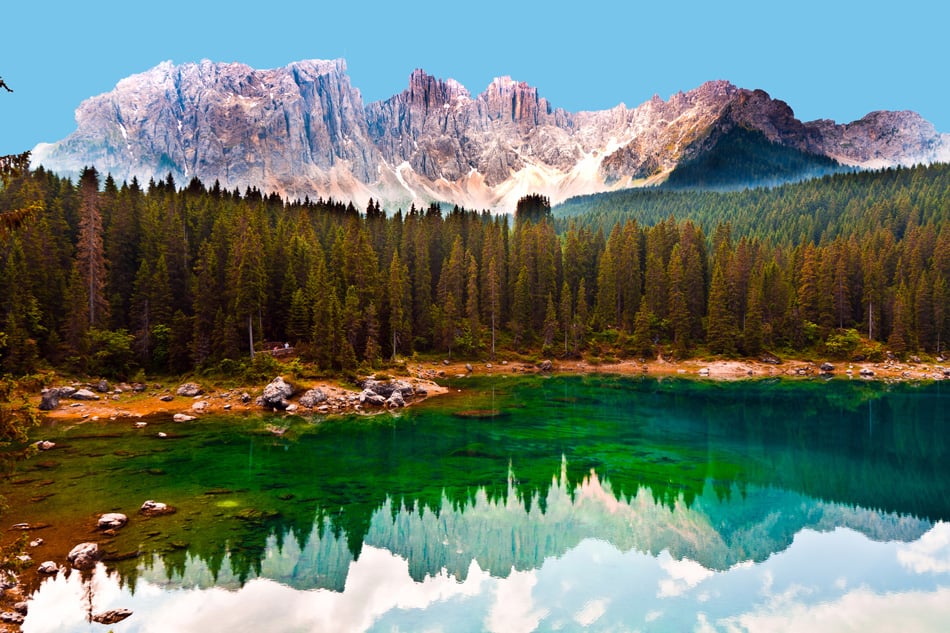 Perfectly clear emerald lake in Dolomites
