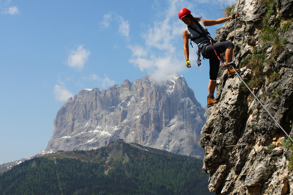 Young woman climbing in the Dolomits Italy