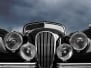 Vintage classic car front view with dark clouds