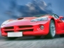 Red Sports Powerful Car On Stone Blocks Against Sky