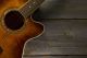 Acoustic guitar on wood background - ID # 134601494