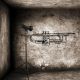 Grunge Style Graffitti of Trumpet on wall with lighting - ID # 169596830