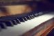 Piano keyboard background with selective focus Warm colors - ID # 236067421