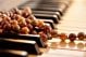 Pearl necklace on piano keyboard - ID # 246518524