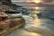 Beautiful rocky sea beach at the sunset in the summer - ID # 98645204