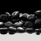 Black Stones On Calm Water Background - ID # 53410710