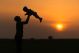 Happy Dad Throws The Baby At Sunset - ID # 60001041