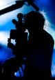 Silhouette Of A Cameraman Filming Fashion Show - ID # 7904636