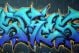 Colorful Graffiti Spray Painted On A Brick Wall - ID # 7970211