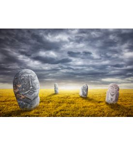 Ancient balbal statues on the field at overcast sky in central Asia - ID # 214683751