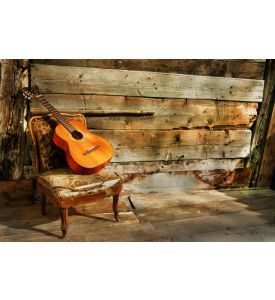 spanish guitar on a old chair with wooden background horizontal - ID # 97111277